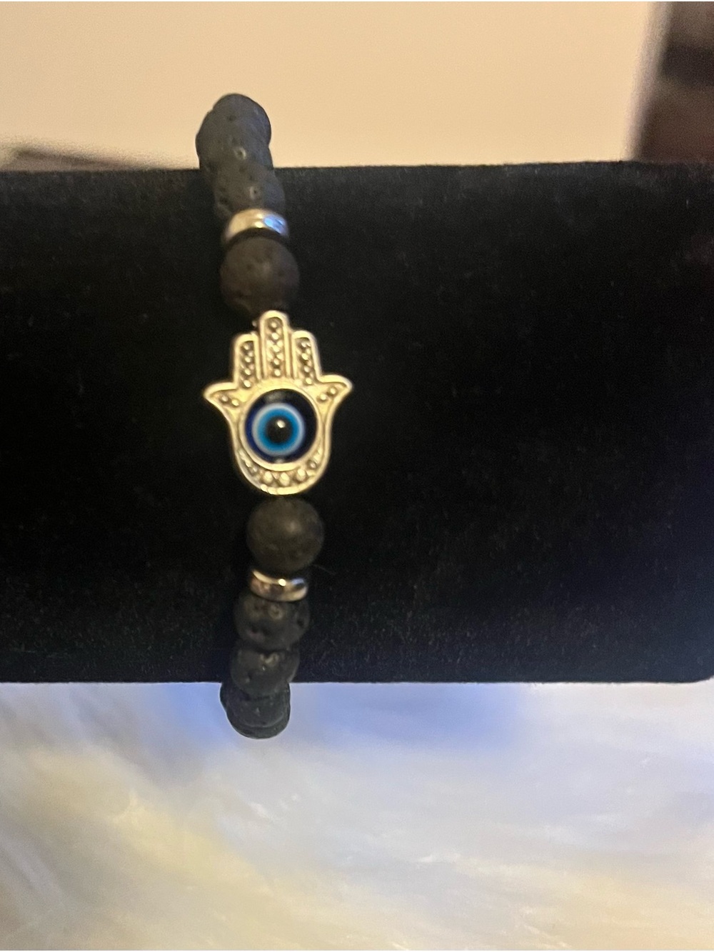 Silver Hamsa Hand Bracelet with Blue Eye on Black Lava Beads